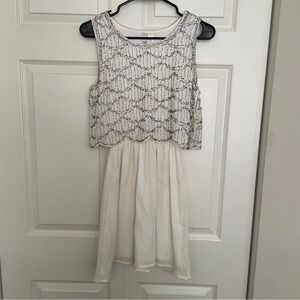Francesca’s retro white beaded dress